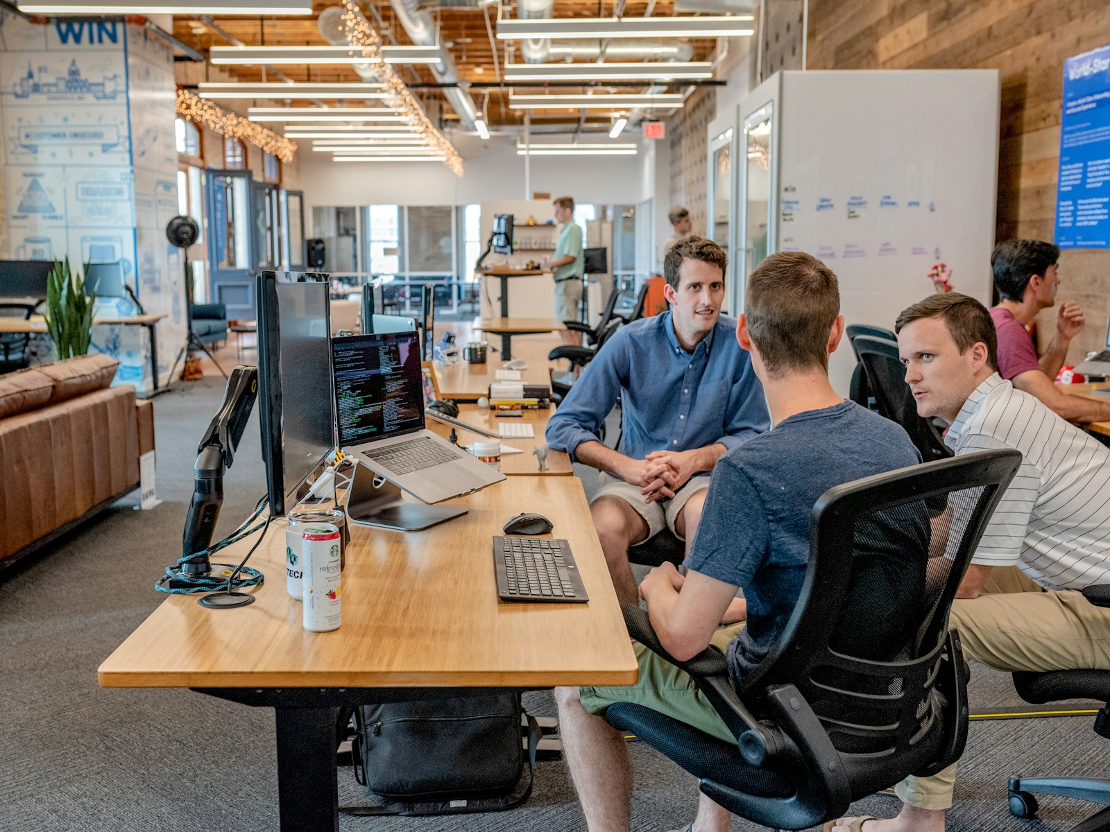A facilitator guiding a small group through a planning module at the Wealth AI Push studio.
